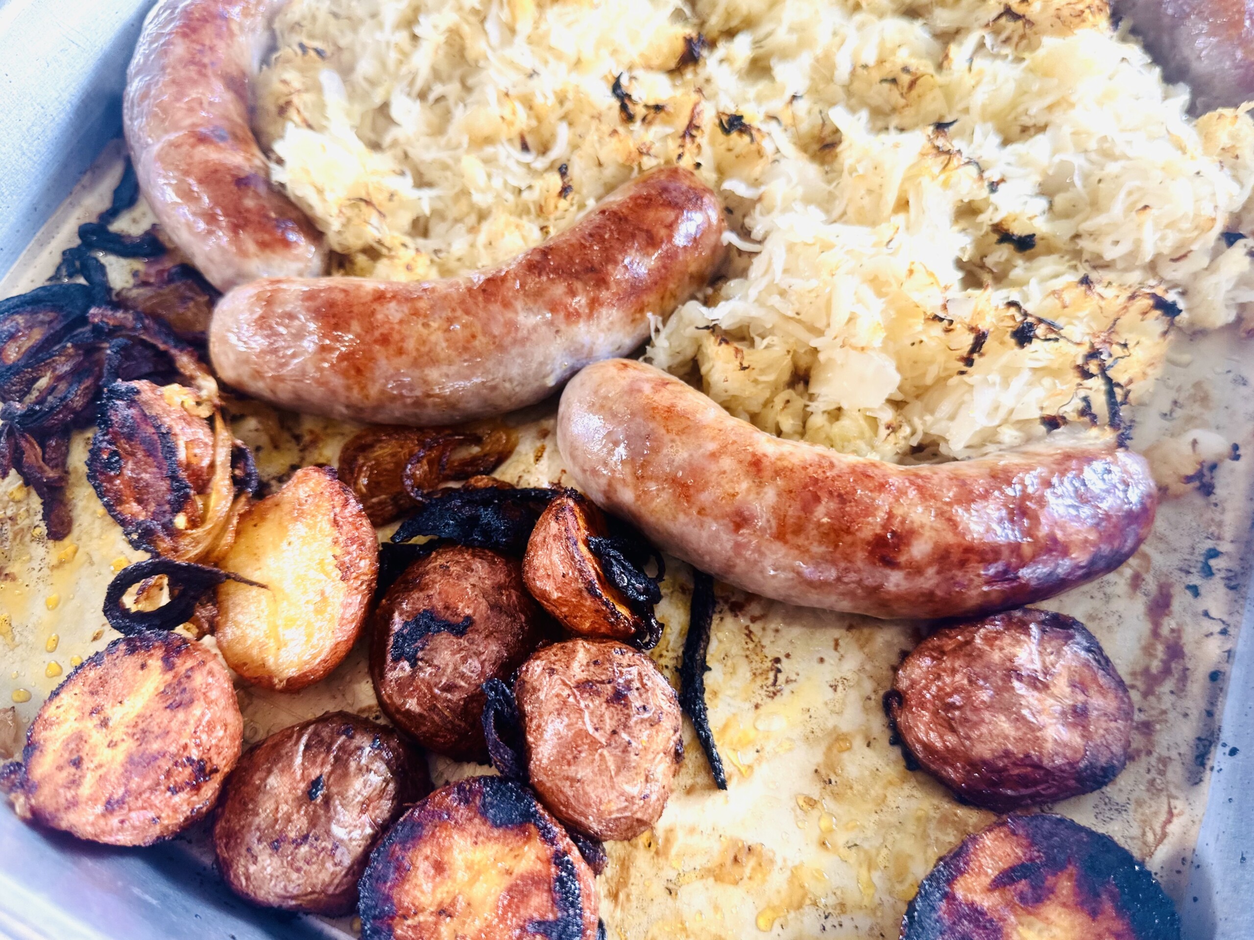 Sheet Pan Bratwurst with Sauerkraut Roasted New Potatoes